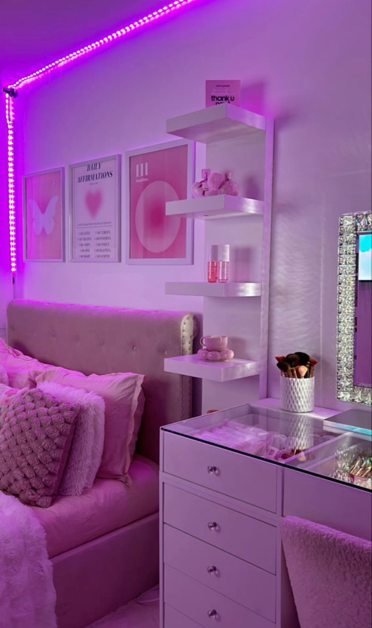 Pink-themed bedroom with LED strip lights, decor items, and a bed.