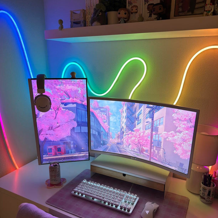 Multicolor LED Rope Light, Alexa compatible, illuminating a gaming setup behind a desktop with vibrant lighting effects.