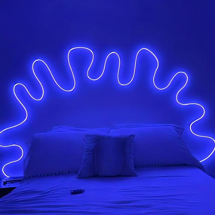 Multicolor LED Rope Light, Alexa compatible, casting a calming blue glow in a bedroom, adding a vibrant and customizable ambiance to the space.
