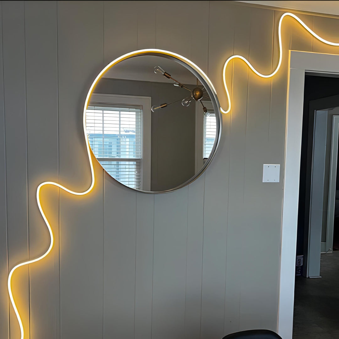 Multicolor LED Rope Light, Alexa compatible, emitting a warm white glow around a mirror, creating a cozy and inviting atmosphere in the room.