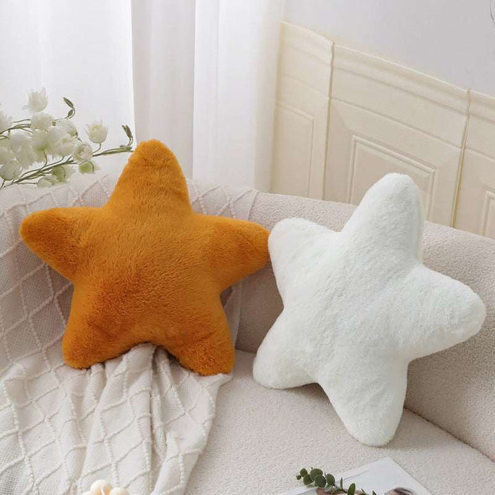 VibeCore Star Throw Pillow in orange and white colors on a couch, featuring a beachy star-shaped design with soft fabric and plush PP cotton fill.