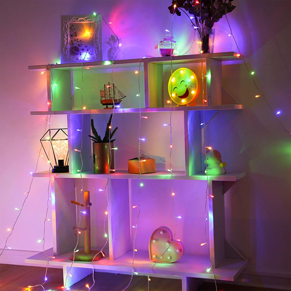 VibeCore 10M colorful traditional string lights in multicolor, draped across a shelf, infusing the space with a vibrant, playful glow, enhancing the room's decor.