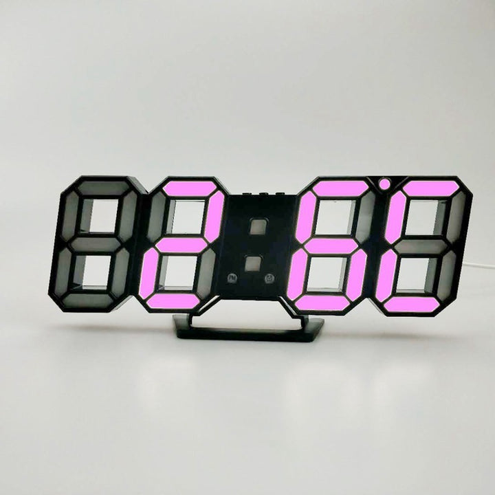 VibeCore 3D LED Digital Alarm Clock in black with pink light, featuring bold, illuminated 3D LED digits for clear time visibility. This modern alarm clock includes extra features such as a thermometer, perpetual calendar, and moon phase display. Its sleek black design with pink light adds a stylish, contemporary touch, combining both functionality and aesthetic appeal in any room.