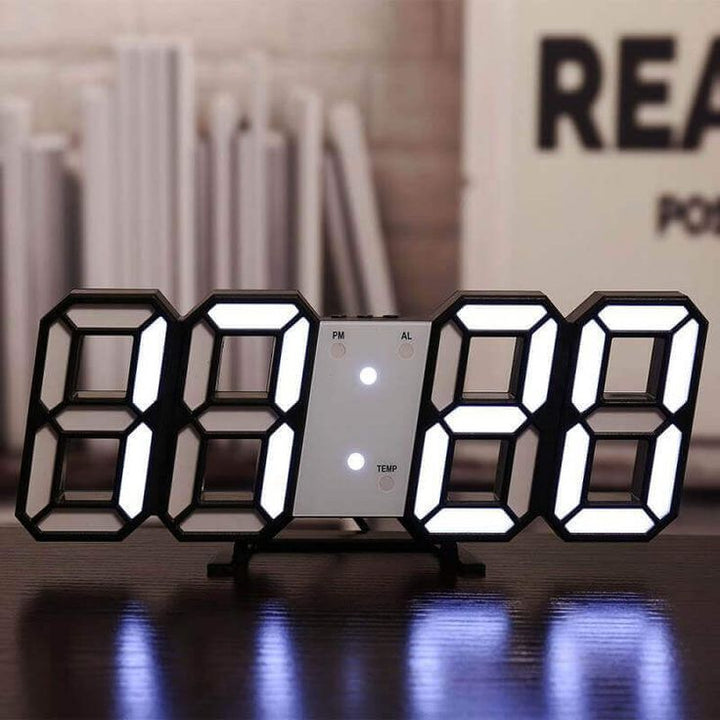 VibeCore 3D LED Digital Alarm Clock in black with white light, featuring bold, illuminated 3D LED digits for easy time readability. This modern alarm clock includes additional features like a thermometer, perpetual calendar, and moon phase display. Its sleek black design adds a contemporary and stylish touch to any room, perfect for both functionality and aesthetic appeal.