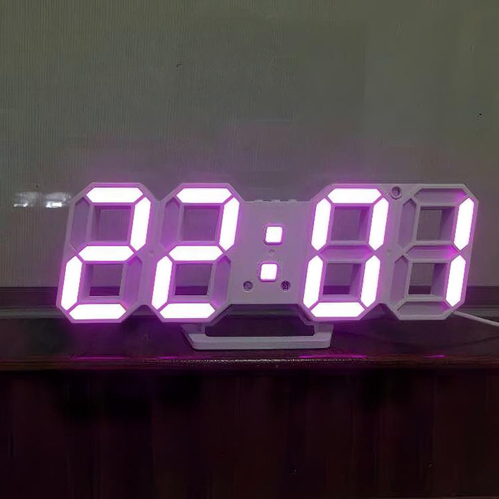 VibeCore 3D LED Digital Alarm Clock in white with pink light, featuring bold, illuminated 3D LED digits for easy time visibility. This modern alarm clock includes additional features like a thermometer, perpetual calendar, and moon phase display. Its sleek white design with pink light adds a stylish, contemporary touch, making it a perfect blend of functionality and aesthetic appeal for any room.
