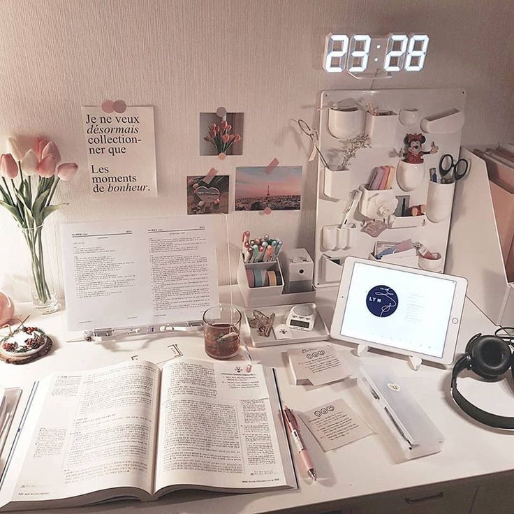 VibeCore 3D LED Digital Alarm Clock in white with white light, displayed on wall above desk. Featuring bold, illuminated 3D LED digits for easy readability, this sleek alarm clock offers additional features like a thermometer, perpetual calendar, and moon phase display. Its contemporary rectangular design enhances any room, making it a stylish and functional addition to your workspace or bedroom.