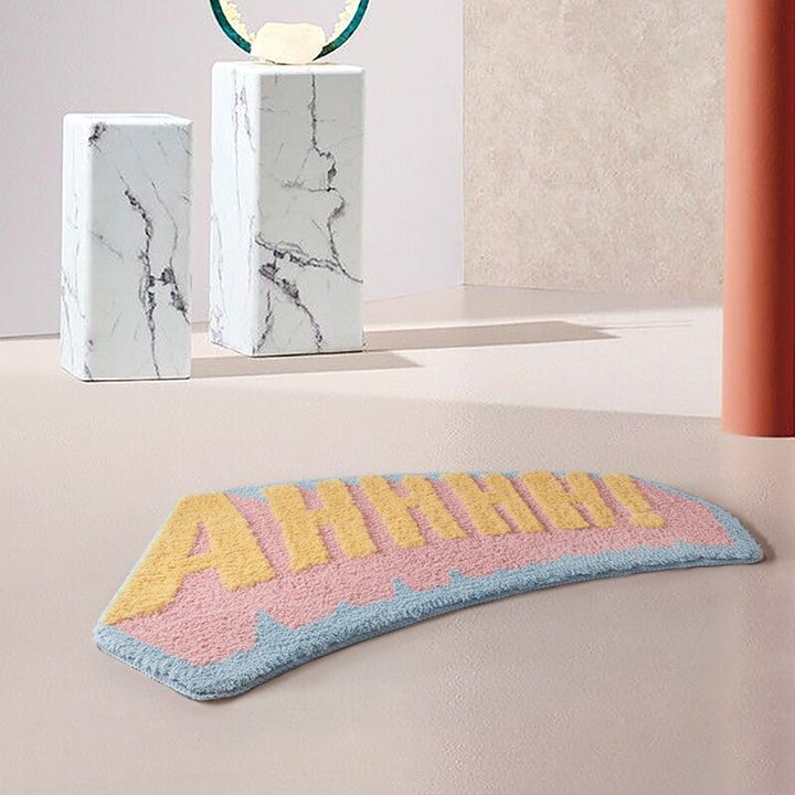 VibeCore AHHHH! Accent Rug on the floor, displaying its bold, playful design that adds a burst of energy to the space. The non-slip backing ensures it stays securely in place.