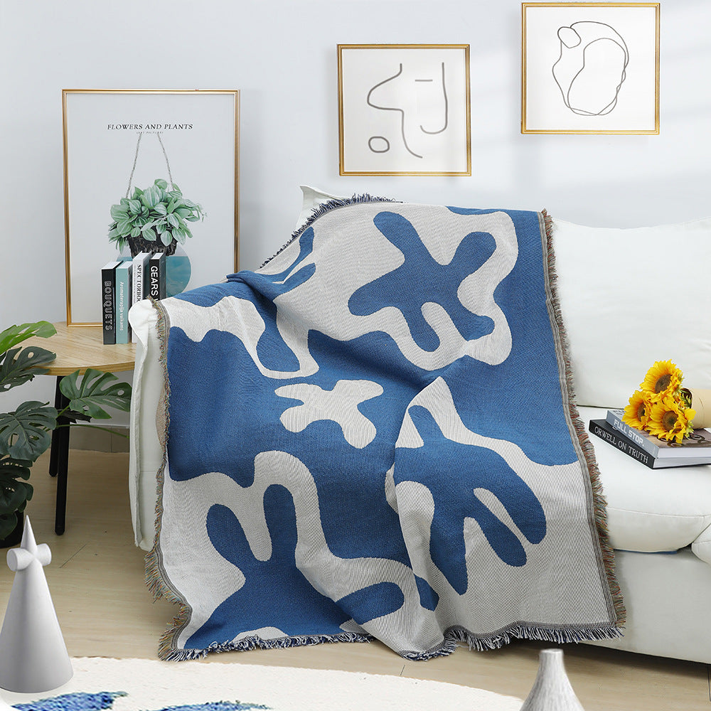 Soft Abstract Blue Coral Woven Cotton Blanket Draped on a Couch – Reversible, Artistic Throw for Cozy Living Room Decor