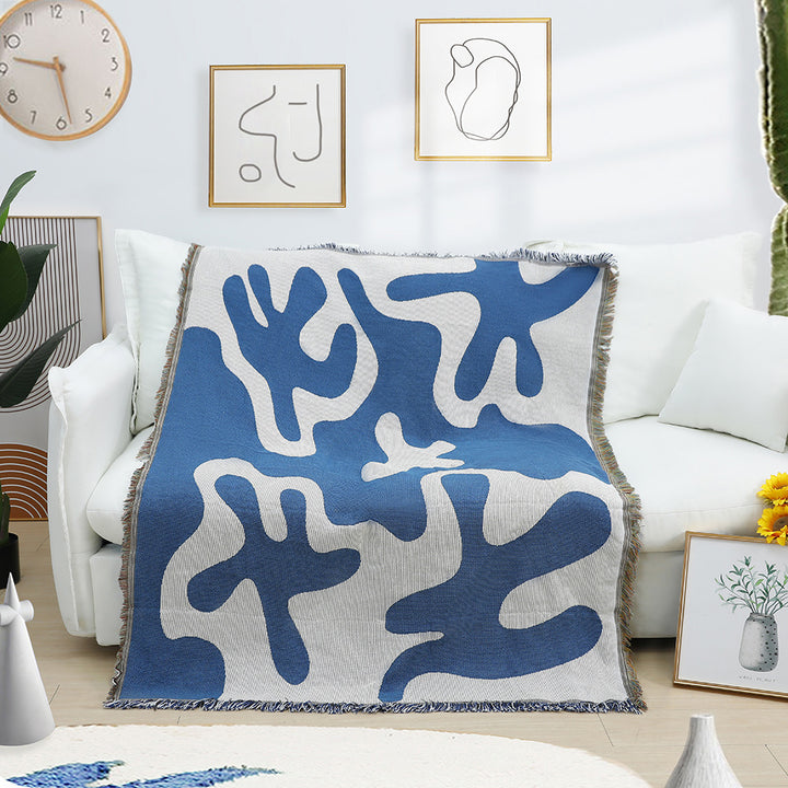 Abstract Blue Coral Woven Cotton Blanket Draped Over Living Room Couch – Soft Reversible Throw for Modern Boho Home Decor