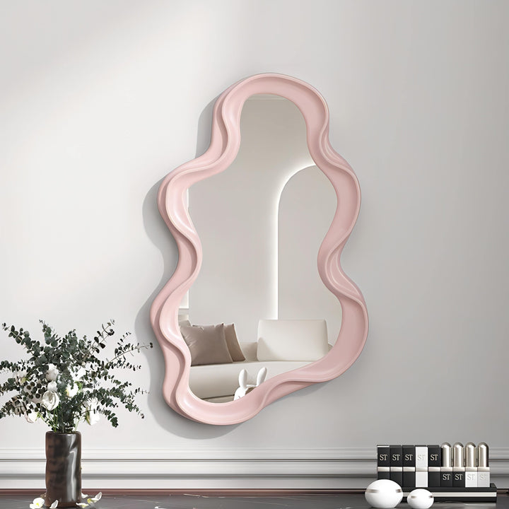 VibeCore Abstract Curve Wall Mirror Light Pink Ripple: A stylish mirror with a soft light pink ripple design, adding a gentle, artistic touch to any room while reflecting light to create a brighter, more inviting atmosphere.