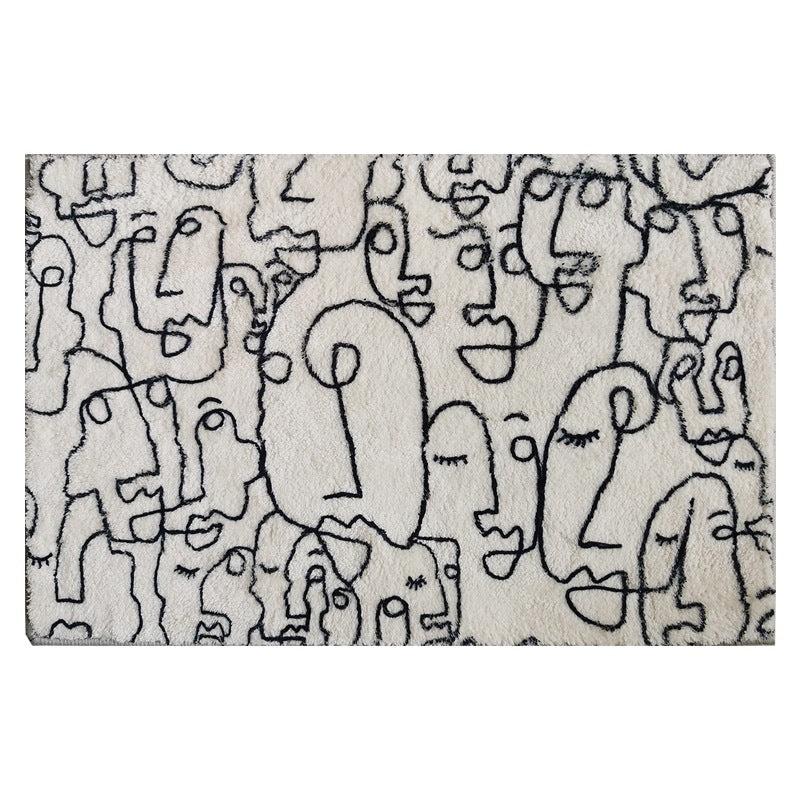 Full product view of VibeCore Abstract Faces Rug, featuring modern black and white abstract face designs, with a plush texture and non-slip backing for added safety.