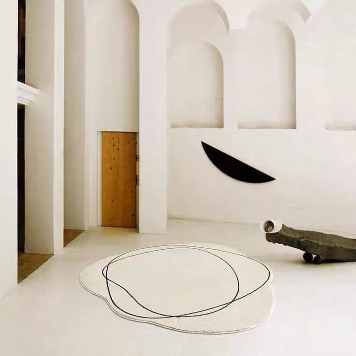 VibeCore Abstract Squiggle Area Rug in a white room, placed on the floor. The rug's playful squiggle design and soft imitation cashmere texture add a modern and artistic vibe to the minimalist room decor.