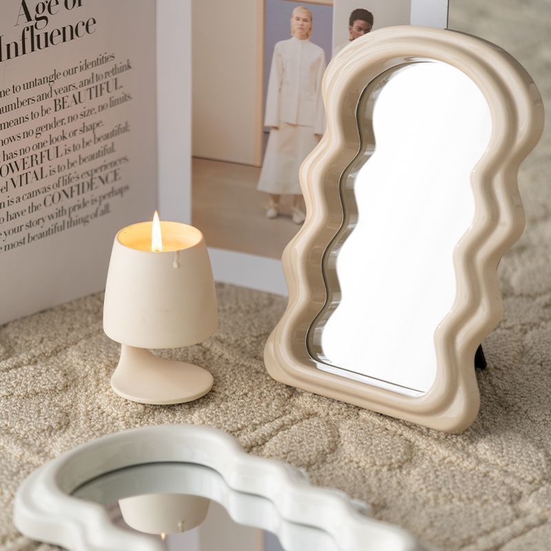 Aesthetic abstract wave makeup mirror in beige and white featuring a sleek wavy design and high-clearness silver mirror perfect for modern vanity setups home decor and portable styling