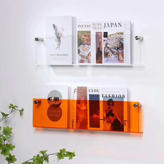 VibeCore Acrylic Wall Mounted Floating Magazine Shelf in transparent and orange, showcasing a sleek, minimalist design for organizing books, magazines, and decorative items.