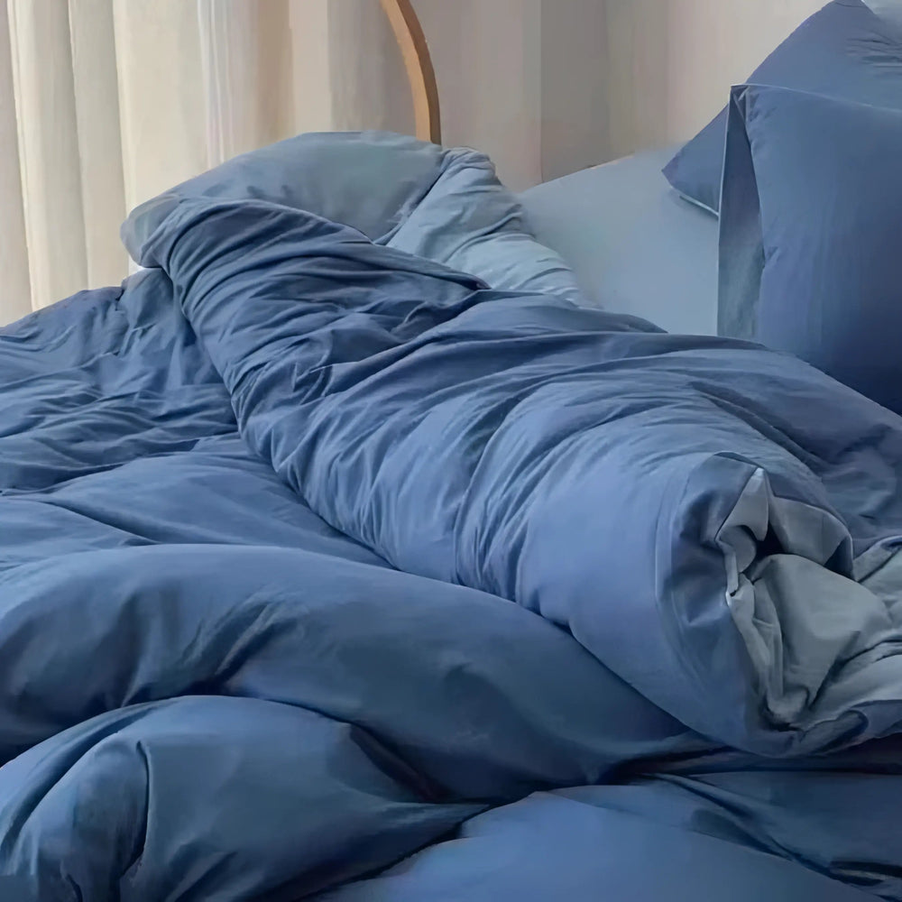 Close-up of the VibeCore Aesthetic Australian Cotton Duvet Cover Set in blue, highlighting the soft, luxurious fabric and clean, minimalist design. Made from premium Australian cotton, this duvet cover offers superior softness and breathability, creating a cozy and sophisticated atmosphere in your bedroom.