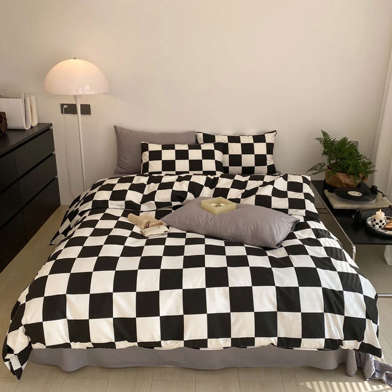 Aerial view of the VibeCore Aesthetic Checkered Duvet Cover Set in black and white, showcasing its bold checkered design made from 100% ultra-soft cotton. Perfect for a modern, minimalist bedroom or dorm setup, offering cozy, breathable comfort with effortless style.