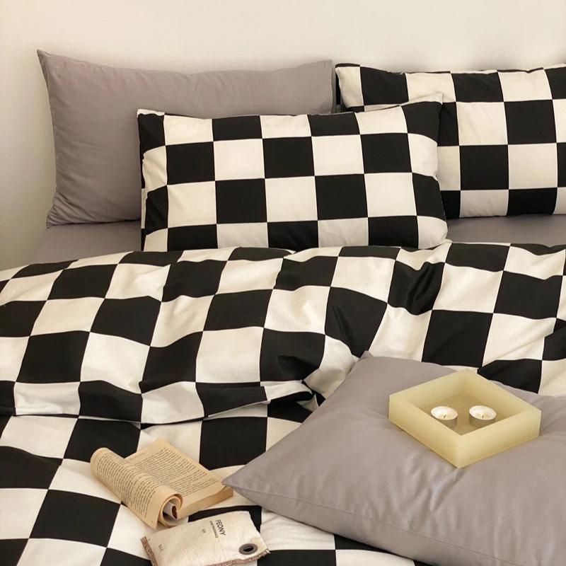 Close-up view of the pillowcase from the VibeCore Aesthetic Checkered Duvet Cover Set in black and white, showcasing the bold checkered design and soft, breathable 100% cotton fabric. A stylish and cozy accent for any modern bedroom or dorm.