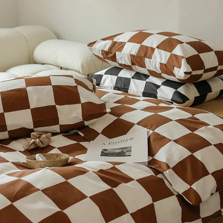 Close-up view of the VibeCore Aesthetic Checkered Duvet Cover Set in brown, highlighting the intricate checkered pattern and ultra-soft 100% cotton fabric. A perfect blend of modern style and cozy comfort for any bedroom or dorm.
