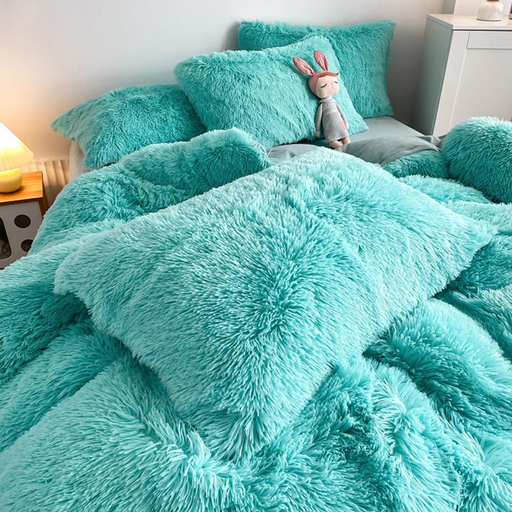 Close-up of the pillow cover and duvet from the VibeCore Cloud 9 Bedding Set in the color Aqua, showcasing ultra-soft fleece fabric for exceptional comfort. This cozy, luxurious bedding set adds warmth and style to your bedroom or dorm, perfect for staying warm, relaxing, or enhancing your space.