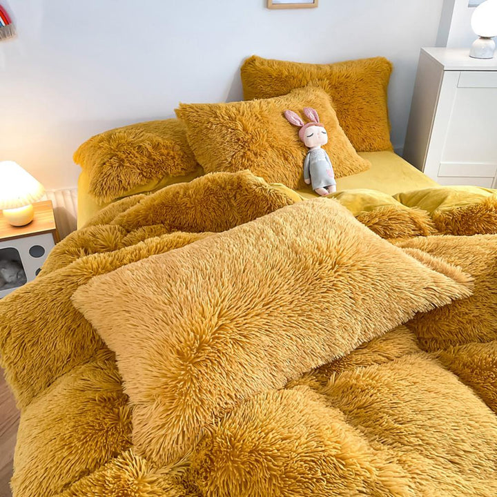 Close-up of the pillow cover and duvet from the VibeCore Cloud 9 Bedding Set in the color Mustard Yellow, showcasing ultra-soft fleece fabric for exceptional comfort. This cozy, luxurious bedding set adds warmth and style to your bedroom or dorm, perfect for staying warm, relaxing, or enhancing your space.