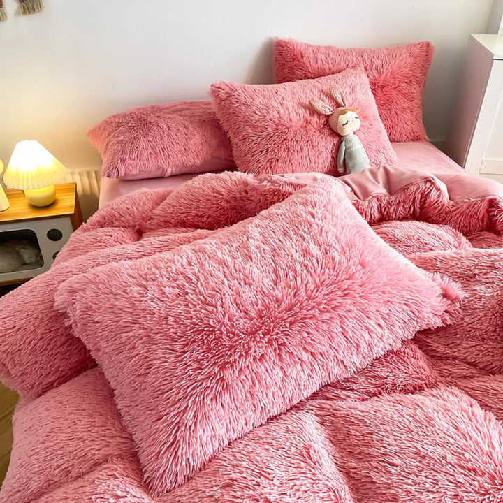Close-up of the pillow cover and duvet from the VibeCore Cloud 9 Bedding Set in the color Pink, showcasing ultra-soft fleece fabric for exceptional comfort. This cozy, luxurious bedding set adds warmth and style to your bedroom or dorm, perfect for staying warm, relaxing, or enhancing your space.