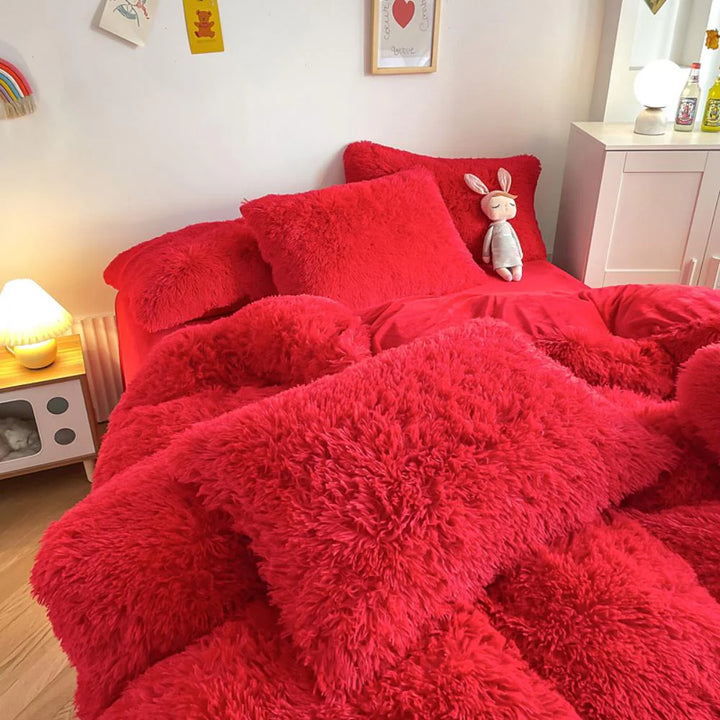 Close-up of the pillow cover and duvet from the VibeCore Cloud 9 Bedding Set in the color Red, showcasing ultra-soft fleece fabric for exceptional comfort. This cozy, luxurious bedding set adds warmth and style to your bedroom or dorm, perfect for staying warm, relaxing, or enhancing your space.