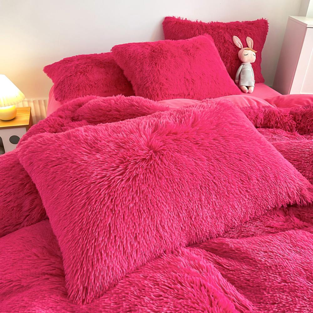 Close-up of the pillow cover and duvet from the VibeCore Cloud 9 Bedding Set in the color Rose Red, showcasing ultra-soft fleece fabric for exceptional comfort. This cozy, luxurious bedding set adds warmth and style to your bedroom or dorm, perfect for staying warm, relaxing, or enhancing your space.