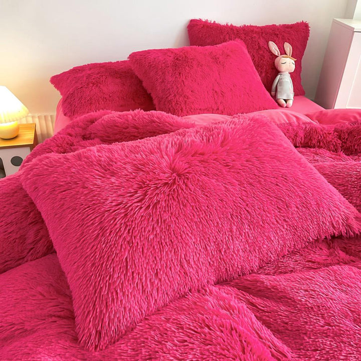 Close-up of the pillow cover and duvet from the VibeCore Cloud 9 Bedding Set in the color Rose Red, showcasing ultra-soft fleece fabric for exceptional comfort. This cozy, luxurious bedding set adds warmth and style to your bedroom or dorm, perfect for staying warm, relaxing, or enhancing your space.