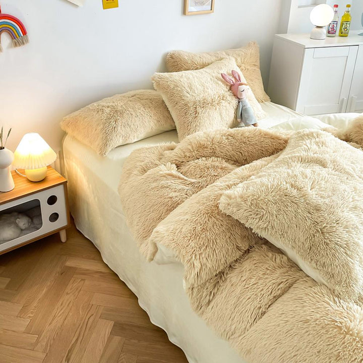 Left angle view of the VibeCore Cloud 9 Bedding Set in the color Beige, featuring ultra-soft fleece fabric for unmatched comfort and warmth. This cozy bedding set adds a touch of luxury and style to your bedroom or dorm, perfect for relaxing and unwinding after a long, cold day.
