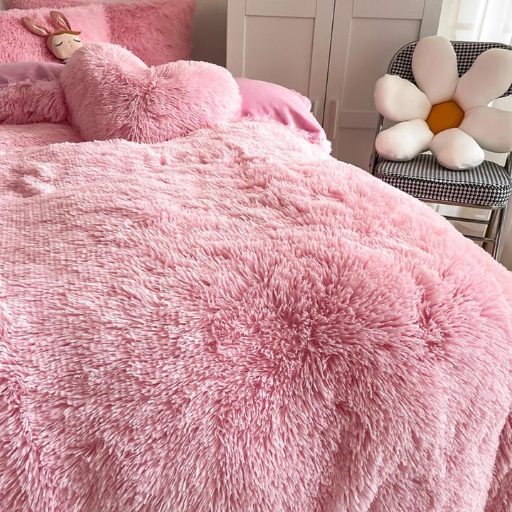 Ultra close-up of the plush material of the VibeCore Cloud 9 Plush Bedding Set in the colour Light Pink, showcasing its ultra-soft fleece fabric for superior comfort and cozy warmth. Perfect for creating a luxurious, comfortable sleep environment and adding stylish elegance to your bedroom or dorm.