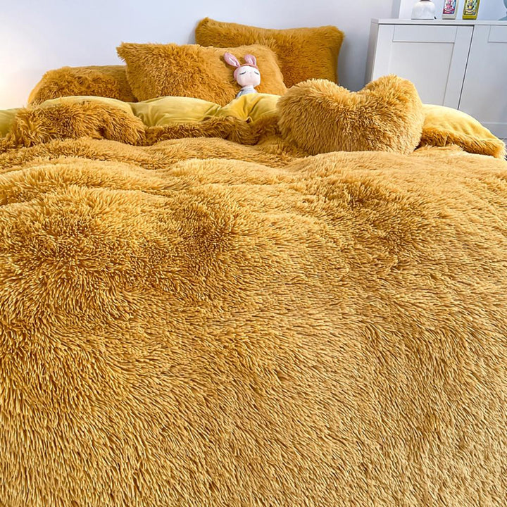 Ultra close-up of the plush material of the VibeCore Cloud 9 Plush Bedding Set in the colour Mustard Yellow, showcasing its ultra-soft fleece fabric for superior comfort and cozy warmth. Perfect for creating a luxurious, comfortable sleep environment and adding stylish elegance to your bedroom or dorm.