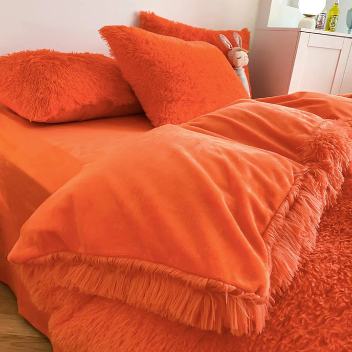 Close-up of the duvet cover from the VibeCore Cloud 9 Bedding Set in the color Orange, featuring ultra-soft fleece fabric for ultimate comfort and cozy luxury. Perfect for adding warmth, style, and a plush feel to your bedroom or dorm, ideal for sleeping or relaxing.