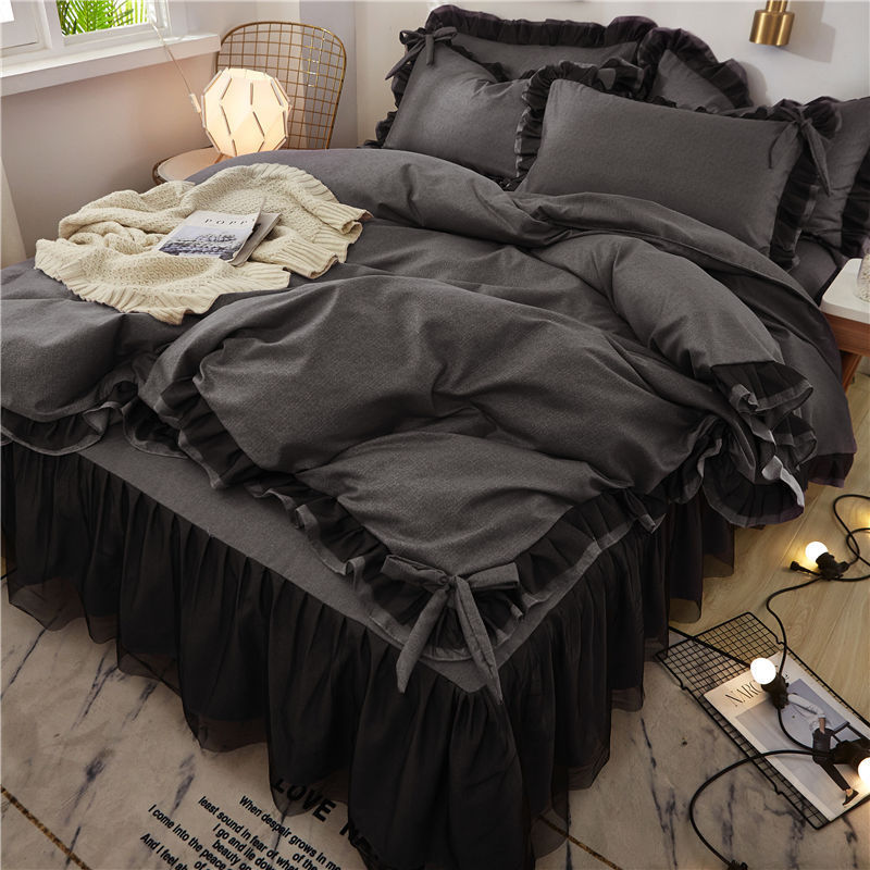 Close-up of the bow-tie feature on the duvet cover of the 'Coquette Goddess Bedding Set' in Black, showcasing its delicate, decorative detail and elegant craftsmanship. A charming touch that enhances the set's sophisticated aesthetic.