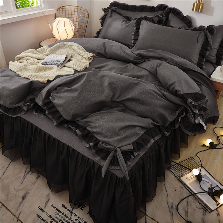 Close-up of the bow-tie feature on the duvet cover of the 'Coquette Goddess Bedding Set' in Black, showcasing its delicate, decorative detail and elegant craftsmanship. A charming touch that enhances the set's sophisticated aesthetic.