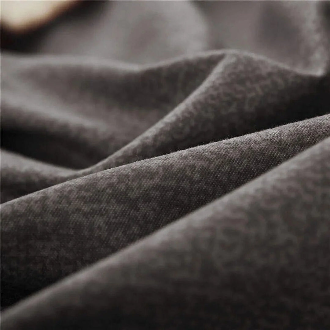Close-up of the fabric used in the 'Coquette Goddess Bedding Set' in the color Black, highlighting its smooth, soft texture and high-quality material. The fabric exudes elegance and comfort, designed for a luxurious sleeping experience.