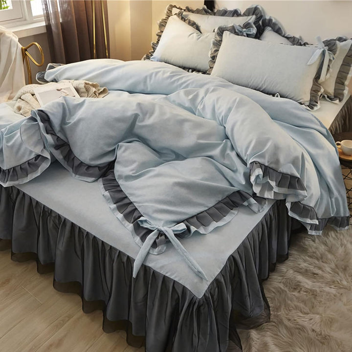 Aerial side view of a 'slept-in' Coquette Goddess Bedding Set in the color Blue Gray, showcasing its soft, luxurious fabric with gentle folds, ruffles and bow-ties, and a relaxed, elegant appearance. Perfect for creating a cozy and sophisticated coquette bedroom or dorm vibe.