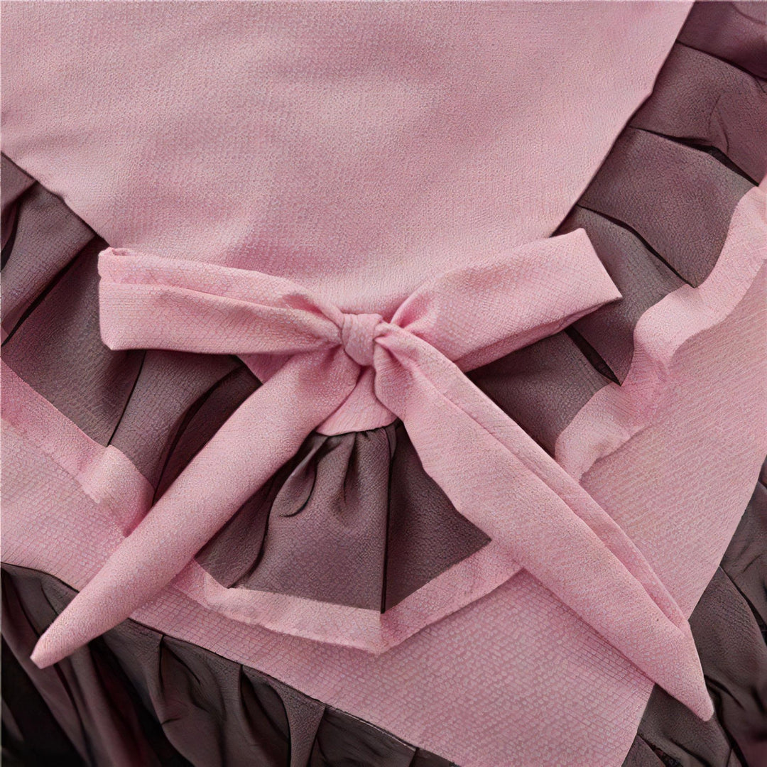Close-up of the bow-tie feature on the duvet cover of the 'Coquette Goddess Bedding Set' in Light Pink, showcasing its delicate, decorative detail and elegant craftsmanship. A charming touch that enhances the set's sophisticated aesthetic.