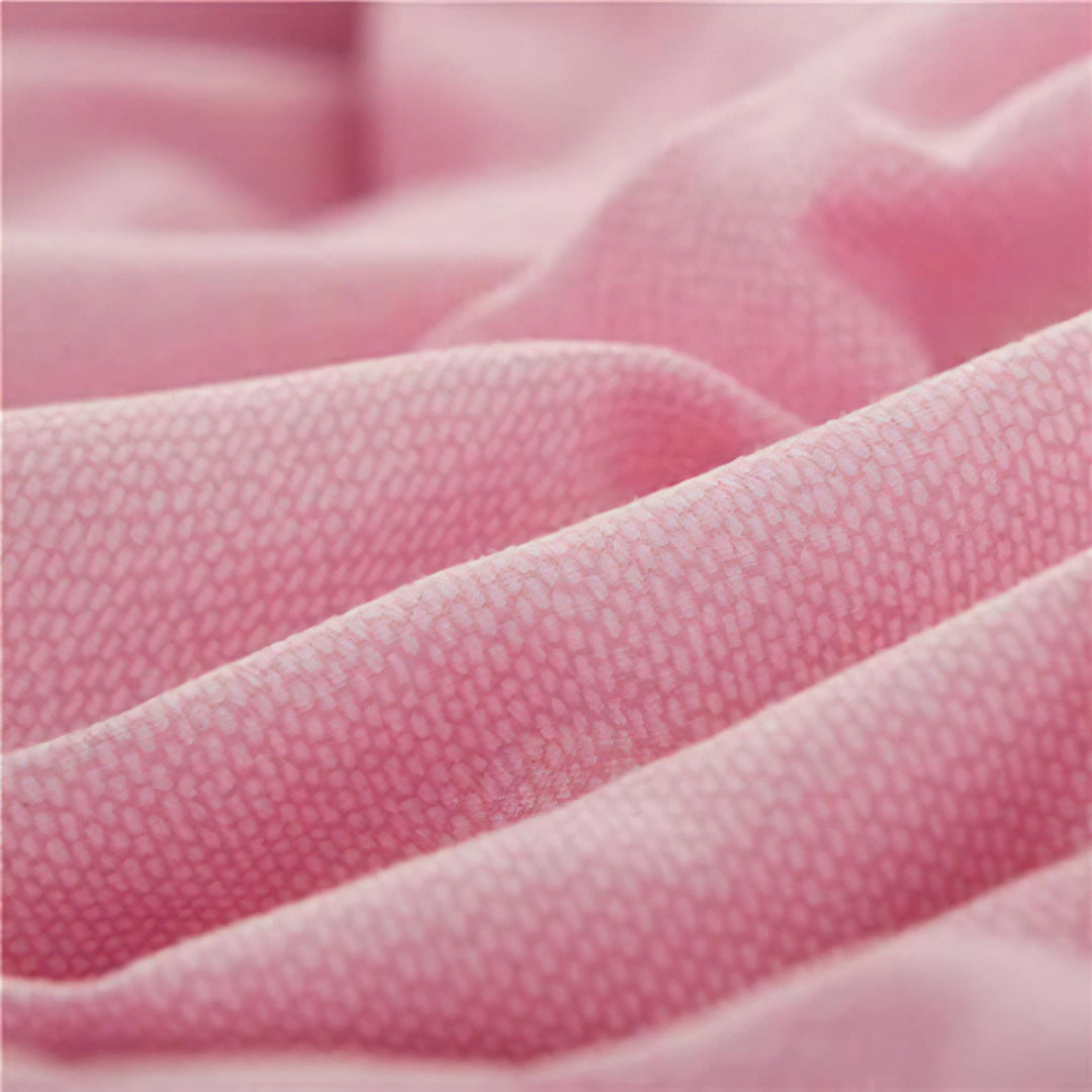 Close-up of the fabric used in the 'Coquette Goddess Bedding Set' in the color Light Pink, highlighting its smooth, soft texture and high-quality material. The fabric exudes elegance and comfort, designed for a luxurious sleeping experience.