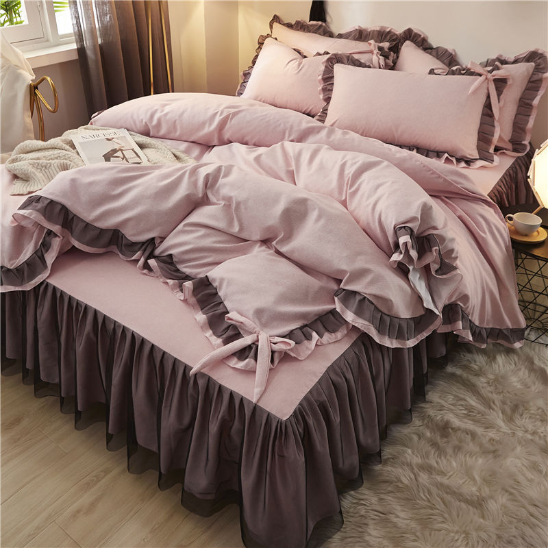 Aerial side view of a 'slept-in' Coquette Goddess Bedding Set in the color mauve, showcasing its soft, luxurious fabric with gentle folds, ruffles and bow-ties, and a relaxed, elegant appearance. Perfect for creating a cozy and sophisticated coquette bedroom or dorm vibe.
