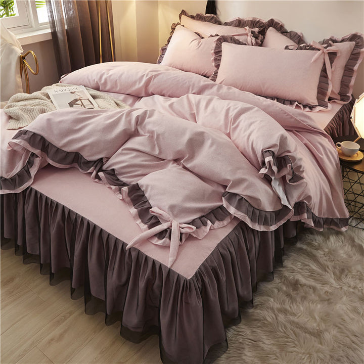 Aerial side view of a 'slept-in' Coquette Goddess Bedding Set in the color mauve, showcasing its soft, luxurious fabric with gentle folds, ruffles and bow-ties, and a relaxed, elegant appearance. Perfect for creating a cozy and sophisticated coquette bedroom or dorm vibe.