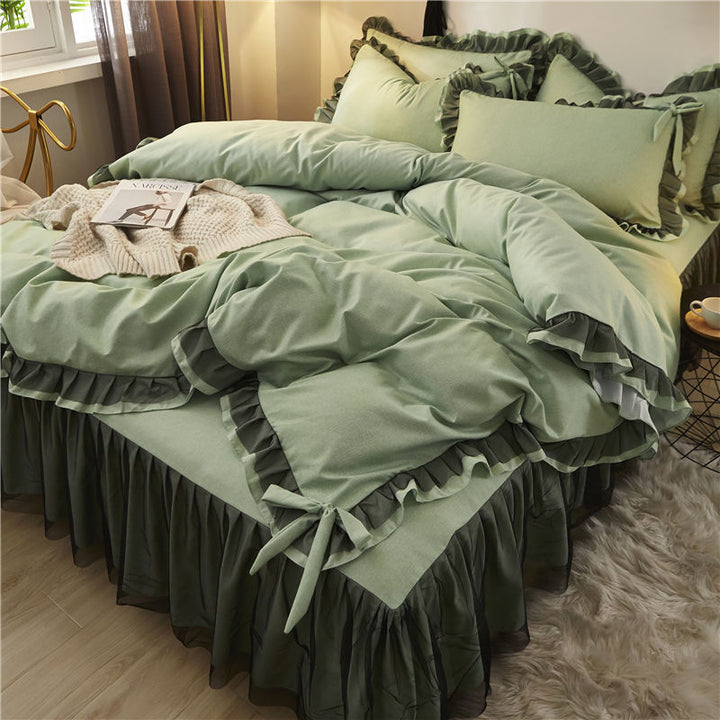 Aerial side view of a 'slept-in' Coquette Goddess Bedding Set in the color Sage, showcasing its soft, luxurious fabric with gentle folds, ruffles and bow-ties, and a relaxed, elegant appearance. Perfect for creating a cozy and sophisticated coquette bedroom or dorm vibe.