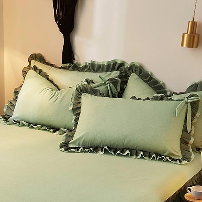 Close-up of the pillow cover from the 'Coquette Goddess Bedding Set' in the color Sage, showcasing its intricate detailing, soft fabric,  elegant ruffles, and cute bow-ties. Perfect for adding a touch of coquette luxury and comfort to your bedroom or dorm.