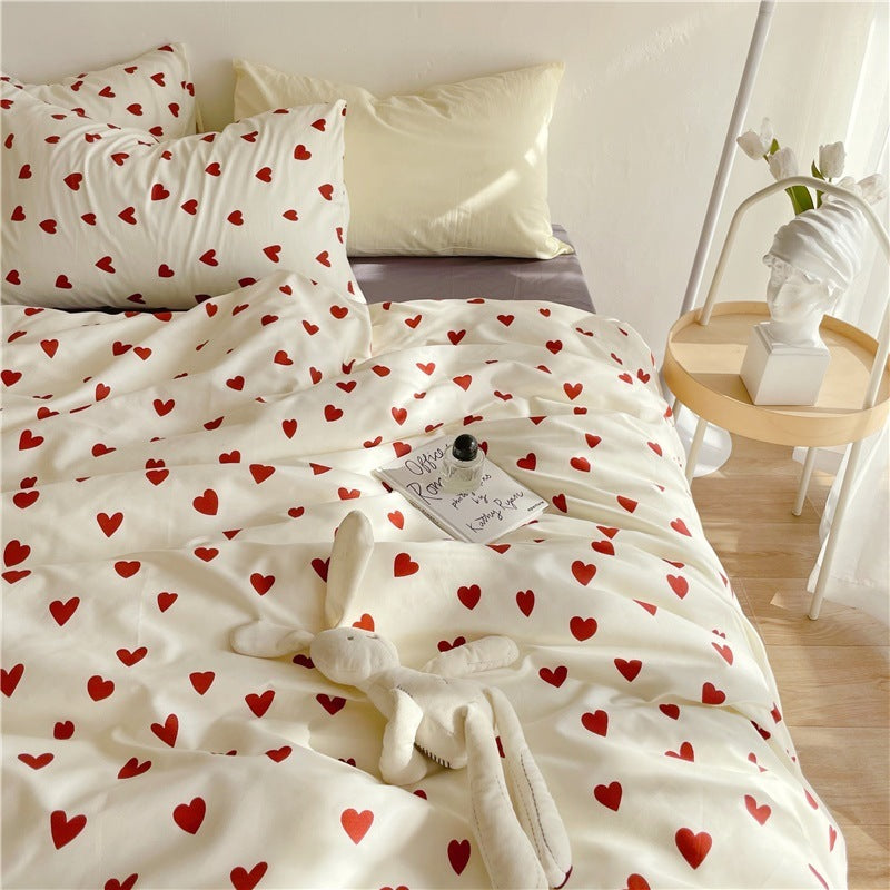 Close-up of the right side of the VibeCore Crimson Love Bedding Set, highlighting the soft cotton-polyester fabric and vibrant crimson heart pattern for a cozy, romantic bedroom or dorm aesthetic.