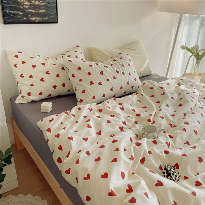 Side view of the VibeCore Crimson Love Bedding Set, highlighting the soft, cotton-polyester fabric and the bold crimson heart pattern for a chic and cozy look.