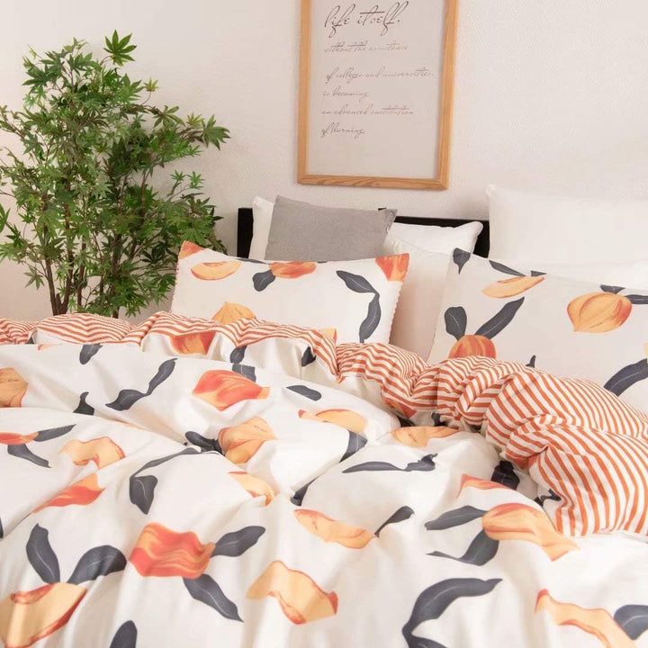Close-up of the VibeCore Aesthetic Just Peachy Watercolor Duvet Cover Set, showcasing the soft watercolor peach tones and the smooth texture of the cotton-polyester blend. The delicate, fluid design adds a serene and inviting touch to your bedroom or dorm, offering comfort and style for all seasons.