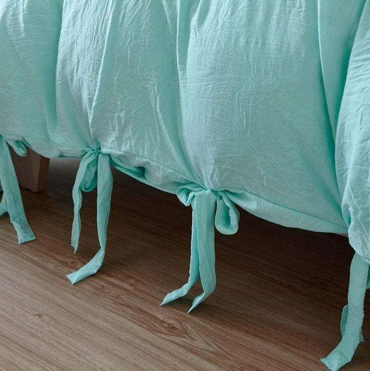 Close-up of the knot ends on the aqua duvet cover from the VibeCore Aesthetic Knot So Ordinary Duvet Cover Set, highlighting the chic knot detail that adds a modern, stylish flair to your bedding.