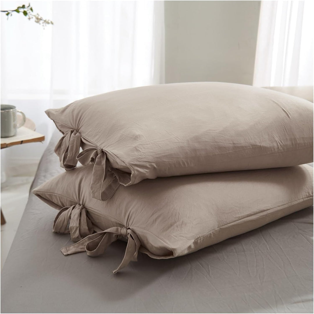 Close-up of the beige pillowcase from the VibeCore Aesthetic Knot So Ordinary Duvet Cover Set, featuring a soft, textured fabric with unique knot edge detailing for an added cozy, stylish vibe to your bedroom or dorm. 