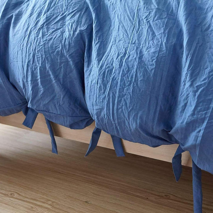 Close-up of the knot ends on the blue duvet cover from the VibeCore Aesthetic Knot So Ordinary Duvet Cover Set, highlighting the chic knot detail that adds a modern, stylish flair to your bedding.