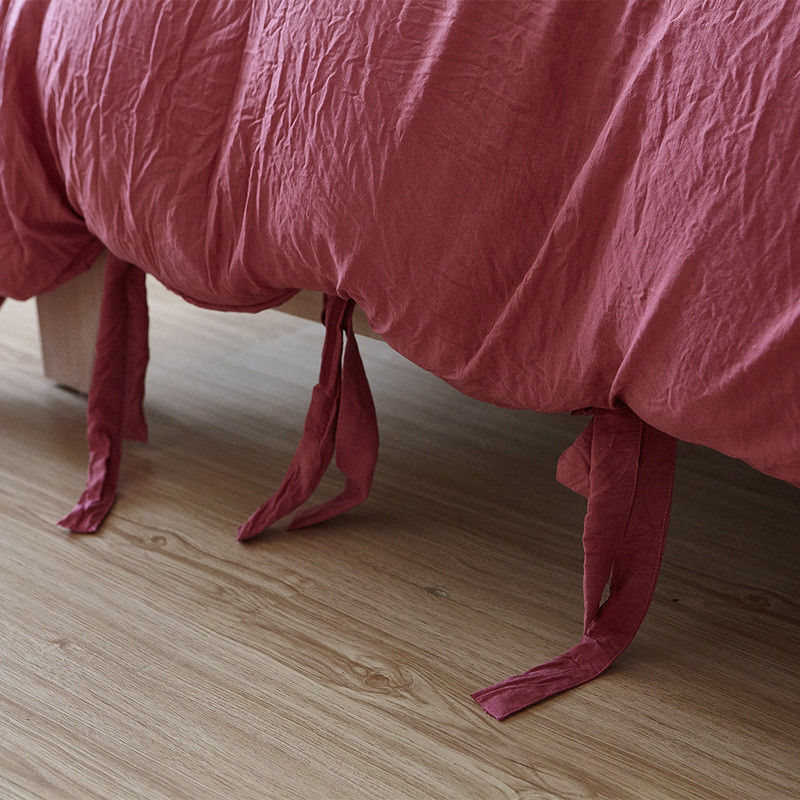 Close-up of the knot ends on the dusty rose duvet cover from the VibeCore Aesthetic Knot So Ordinary Duvet Cover Set, highlighting the chic knot detail that adds a modern, stylish flair to your bedding.