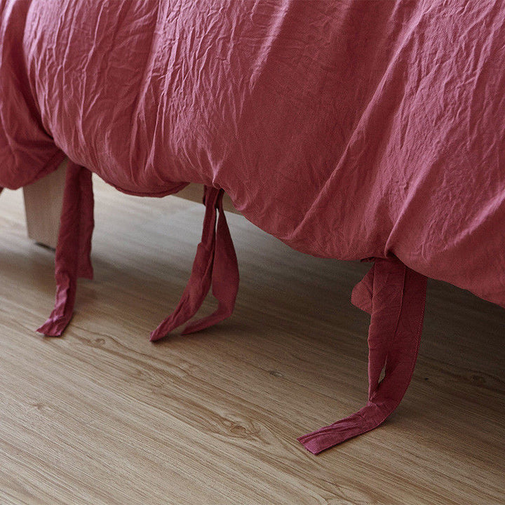 Close-up of the knot ends on the dusty rose duvet cover from the VibeCore Aesthetic Knot So Ordinary Duvet Cover Set, highlighting the chic knot detail that adds a modern, stylish flair to your bedding.